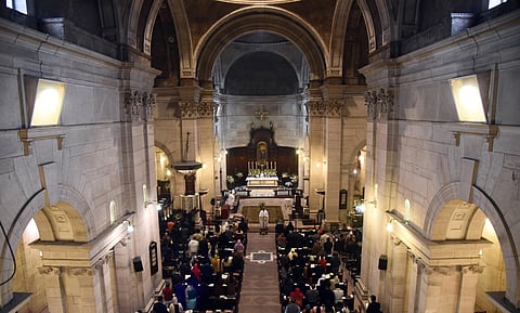 People offering early morning prayers on the occasion of Christmas celebrations at The Church of Cathedral Church of Redemption in New Delhi on Wednesday. (Photo | EPS/Parveen Negi)