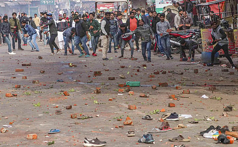 Protestors pelt stones at police personnel after their clash during a rally against NRC and amended Citizenship Act in Lucknow Thursday Dec. 19 2019. (File | PTI)