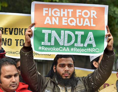 Activists hold placards during anti-Citizenship Act protest (File Photo| PTI)