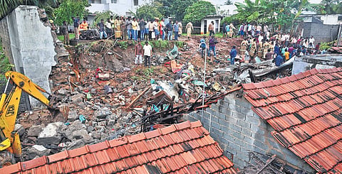 Debris of the wall that collapsed on three tiled-roof houses following heavy rain at Nadur in Mettupalayam on Monday | A RAJA CHIDAMBARAM