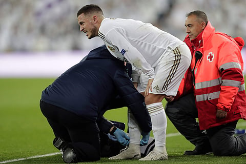 Real Madrid's Eden Hazard reacts after been injured. (Photo | AP)