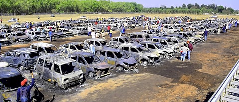 Gutted cars seen at Bharati Nagar Gate's parking area after a massive fire on the 4th day of 12th edition of AERO India 2019 at Yelahanka Air Base in Bengaluru Saturday Feb 23 2019. (Photo| Pandarinath B/EPS)