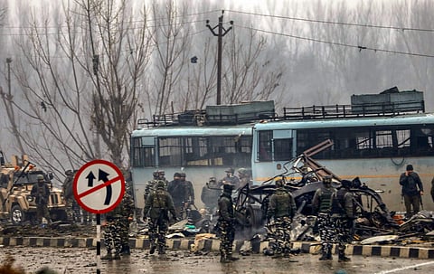 Soldiers at the suicide bomb attack site in Kashmir's Pulwama district. (Photo | PTI)