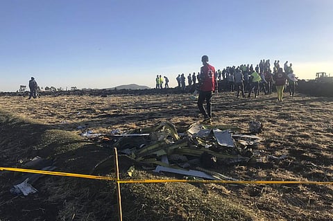 Rescuers search at the scene of an Ethiopian Airlines flight that crashed shortly after takeoff at the scene at Hejere near Bishoftu, or Debre Zeit, some 50 kilometers (31 miles) south of Addis Ababa, in Ethiopia. (Photo | AP)