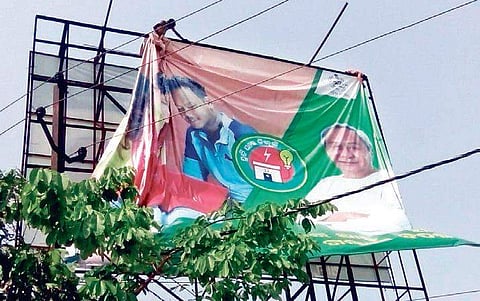 Political banners being removed by the enforcement squads of BMC after imposition of Model Code of Conduct in Bhubaneswar on Monday