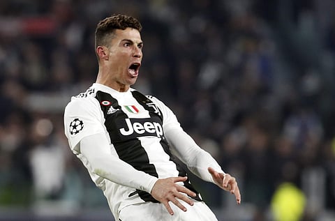 Juventus' Cristiano Ronaldo celebrates after scoring his side's third goal during the Champions League round of 16, 2nd leg, soccer match between Juventus and Atletico Madrid. (Photo | AP)