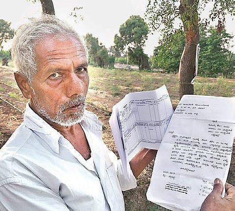 Rajappa showing copies of the letters he has written to authorities| Udayshankar S