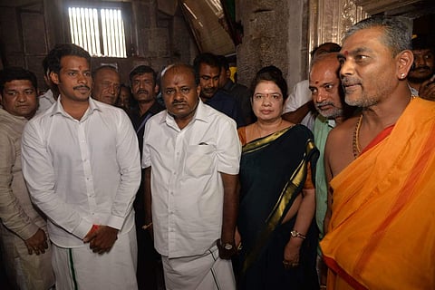 Chief Minister H D Kumaraswamy and his son Nikhil Kumaraswamy, the Mandya Lok Sabha constituency candidate, are seen offering puja at Sri Chamundeshwari Devi Temple atop Chamundi Hill in Mysuru before filing nomination papers. (Photo | Express)