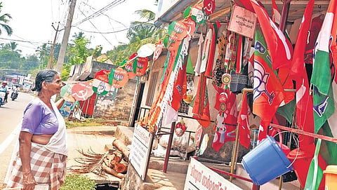 An elderly woman looking at the campaign materials displayed at a shop at Malayinkeezhu in Thiruvanathapuram.| Vincent Pulickal