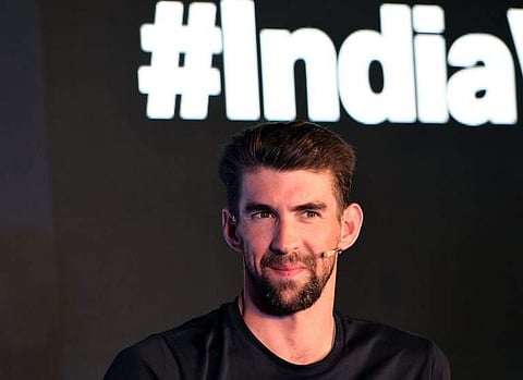 Retired US swimmer Michael Phelps speaks prior to the launch of Under Armour in India during a press conference in New Delhi | AFP