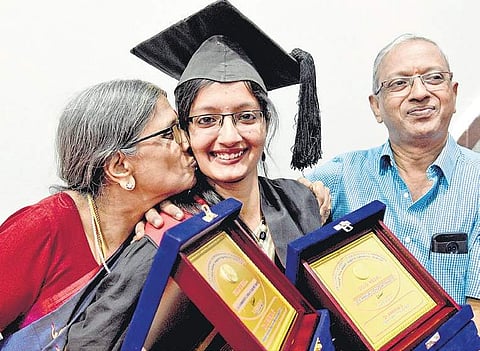 Gold medallist Dr Aparna G with her parents at the 21st annual convocation of RGUHS organised at NIMHANS Convention Centre in Bengaluru on Tuesday | Nagaraja Gadekal