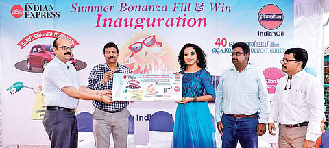 Actor Marina Michael Kurisingal receiving the first Summer Bonanza Fill-and-Win coupon from IOC Deputy General Manager (Retail Sales) K Raghu and The New Indian Express General Manager P Vishnu Kumar in Kochi on Friday.| Arun Angela