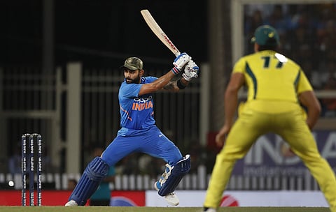 India's captain Virat Kohli, left, bats during the third one day international cricket match between India and Australia in Ranchi, India, Friday, March 8, 2019. | AP