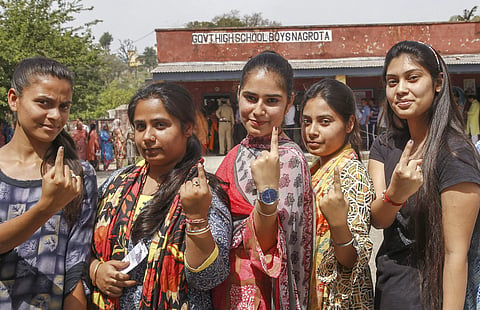 First time voters show their finger marked with indelible ink after casting their vote during the first phase of general elections at Nagrota in Jammu (Photo | PTI)