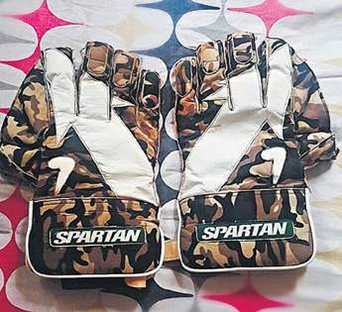 Gloves that Felix received from Indian cricketer M S Dhoni