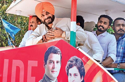 Punjab Minister and former cricketer Navjot Singh Sidhu greeting public during the road show of the campaign rally for UDF Candidate M K Raghavan in Kozhikode on Thursday | Express