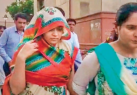 Apoorva Tiwari being escorted by the police on Wednesday | PTI
