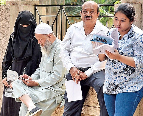 Candidates do the last-minute revision ahead of the Common Entrance Test -2019 held in Bengaluru on Monday (Photo | Nagaraja Gadekal/EPS)