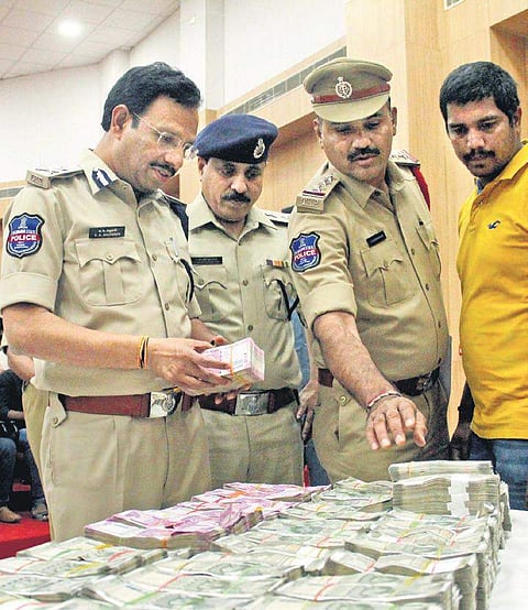 Cyberabad Police Commissioner VC Sajjanar showing the cash seized from two employees of TDP MP Murali Mohan’s Jayabheri properties | S Senbagapandiyan