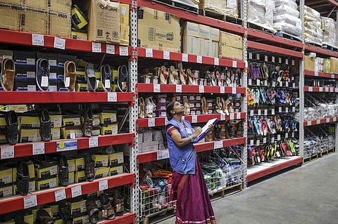 An employee inspects a receipt. Photographer: Dhiraj Singh/Bloomberg