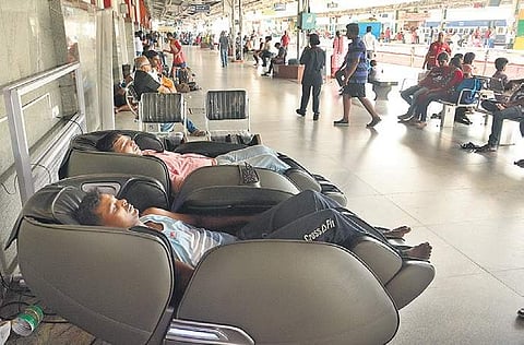 Passengers relaxing at KSR railway station. (Photo | Shriram B N/EPS)