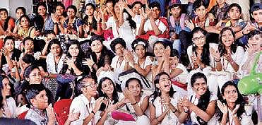 Children clap to a song performed by Jassie Gift, a music composer and playback singer who arrived for the 'Meet the Artist' session held as part of ICFFK at Kairali theatre Vincent Pulickal