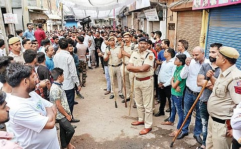 Police stand guard in Moti Nagar area in the wake of protests after businessman Dhruv Tyagi's murder in West Delhi’s Basai Darapur village. (Photo | EPS)