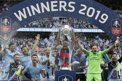 Manchester City players celebrate after winning the English FA Cup Final soccer match between Manchester City and Watford at Wembley stadium in London. (Photo | AP)