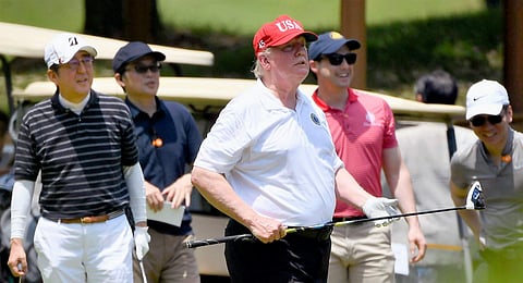 US President Donald Trump (C) plays golf with Japan PM Shinzo Abe (L) at Mobara Country Club in Mobara. (Photo | AP)