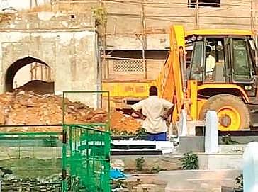 The graveyard being dismantled | Express