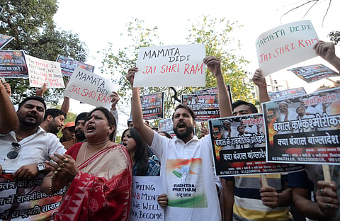 BJP supporters protesting against the murder of 53 BJP workers in West Bengal allegedly by TMC workers for chanting Jai Shri Ram in New Delhi on Sunday. | (Naveen Kumar P | EPS)