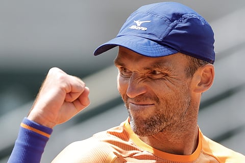 Ivo Karlovic beats Feliciano Lopez in French Open's oldest match-up