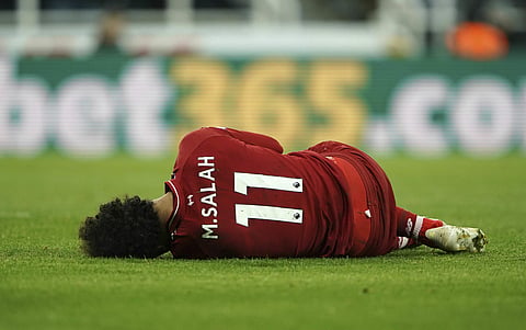 Salah was stretchered off at St James' Park on Saturday due to a head knock | AP