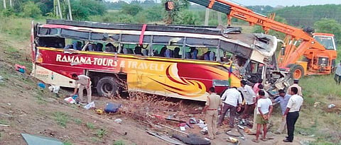 The bus, owned by Kakinada-based Ramana Travels, being lifted by a crane | Express