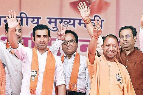 Uttar Pradesh CM Yogi Adityanath with East Delhi candidate Gautam Gambhir during an election rally on Tuesday (Photo | Parveen Negi/EPS)