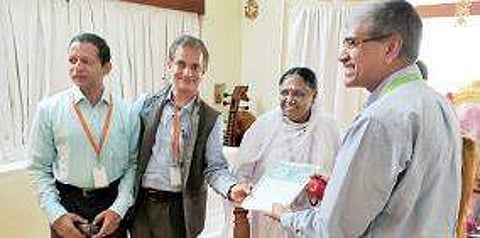 An MoU signed between the Amrita University and Rural Development Ministry in the presence of Venkatrangan (Vice-Chancellor, Amrita University), Kamal Bijlani, (Head, E-Learning Research Lab, Amrita University), Amma (Chancellor, Amrita University)and Dr