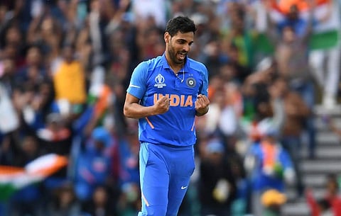 India's Bhuvneshwar Kumar celebrates after the dismissal of Australia's Marcus Stoinis during the 2019 Cricket World Cup group stage match between India and Australia at The Oval in London. (Photo | AFP)