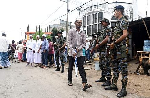 Sri Lankan security personnel stand guard as worshippers gather at Colombo after Friday prayers to remember the victims of Easter Sunday suicide attacks (File Photo | AFP)