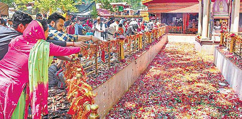 Kashmiri Pandits offer prayers during the annual fair at Kheer Bhawani Temple in Tulmulla of Ganderbal district on Monday. | PTI