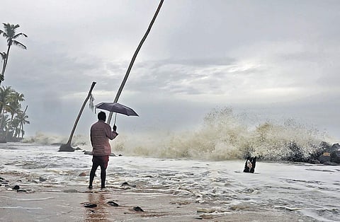 A resident watching the rough sea at Chellanam in Kochi | ARUN ANGELA