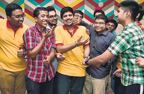 Prajeeth S who secured AIR-33 in JEE Advanced, with his classmates in the city on Friday | P Jawahar