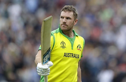 Australia's captain Aaron Finch holds up his bat to applause as he leaves the pitch after he is caught by Sri Lanka's captain Dimuth Karunaratne for 153 during the World Cup cricket match between Sri Lanka and Australia at The Oval in London. (Photo | AP)