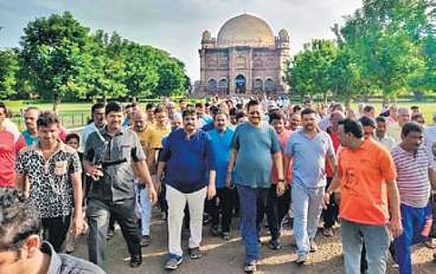 MLA Basangouda Patil Yatnal with morning walkers at Gol Gumbaz | Express