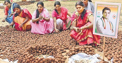 Congress party members prepare seed balls of various plants to mark the birthday of their leader Rahul Gandhi at Cubbon Park on Wednesday| Pandarinath B