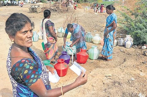 A woman showing a lot given to her to get water, at Karunkulam village in Ramanathapuram district | ponmalar