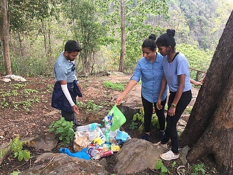 Tourists are clearing plastics near Kanoor waterfalls in Yellapur taluk - Express