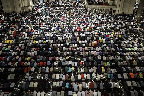 Turkey's Muslims offer prayers during the first day of Eid al-Fitr, which marks the end of the holy fasting month of Ramadan at the Suleymaniye Mosque in Istanbul. (Photo | AP)
