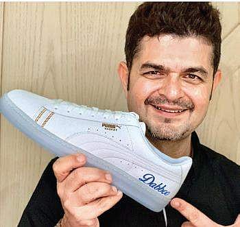 Photographer Dabboo Ratnani with shoe customised by Vaishak