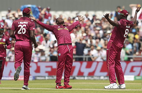 West Indies' Sheldon Cottrell with West Indies teammates. (Photo | AP)