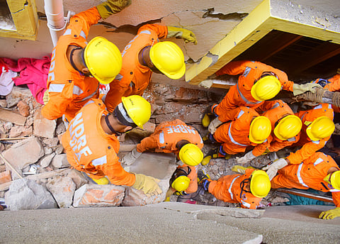 NDRF personnel at the building collapse site in Bengaluru's Cooke Town. (Photo | Pandarinath B, EPS)